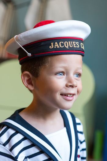 Close-up of happy boy wearing sailor hat