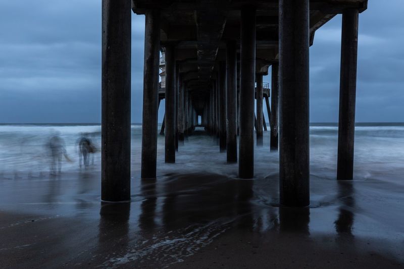 Pier over sea against sky
