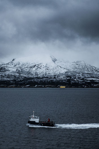 Scenic view of sea against sky during winter
