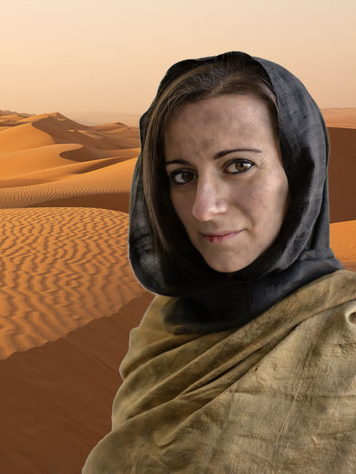 Portrait of young woman in desert