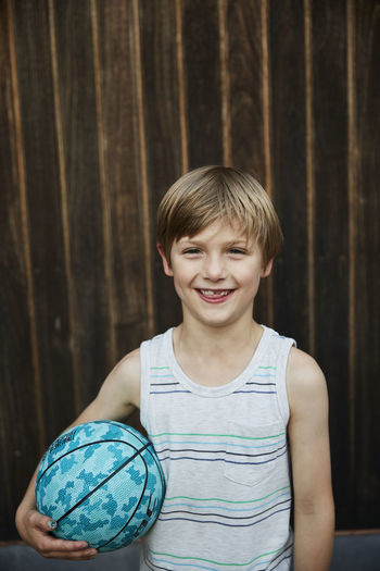 Portrait of boy holding ball