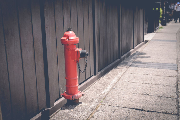 Red fire hose in the city to watch for fire time.