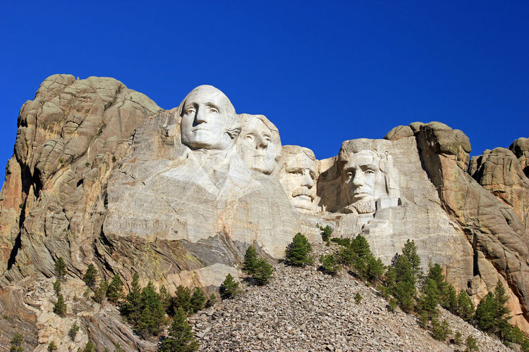 Low angle view of mt rushmore national monument against clear sky