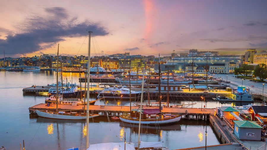 Boats moored at harbor