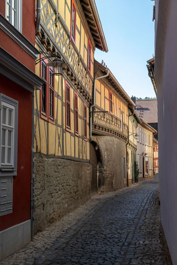 Narrow cobbled alley with facades of historic half-timbered houses in the city meiningen, thuringia