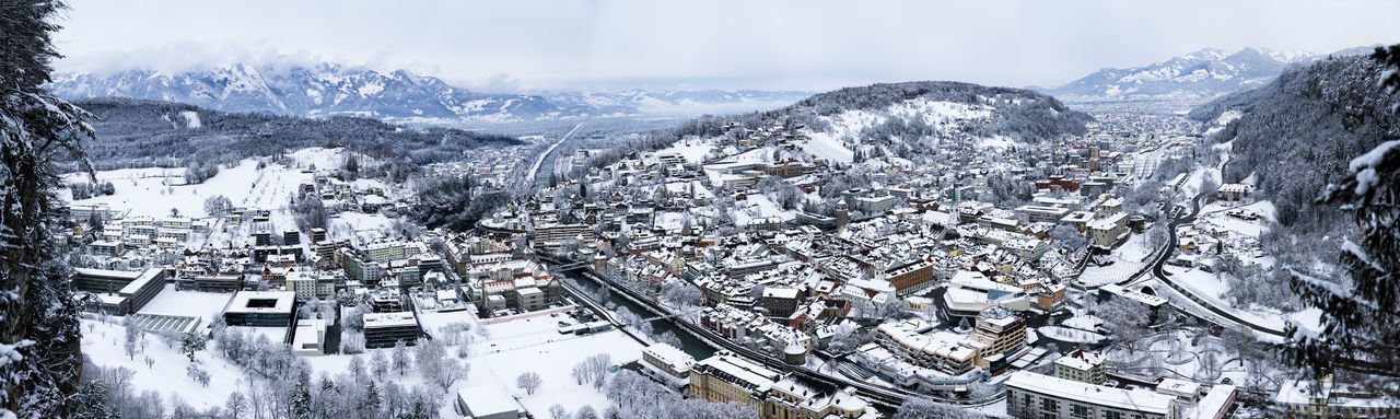 Panoramic view of snow covered buildings in city