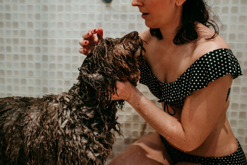 Midsection of woman with dog