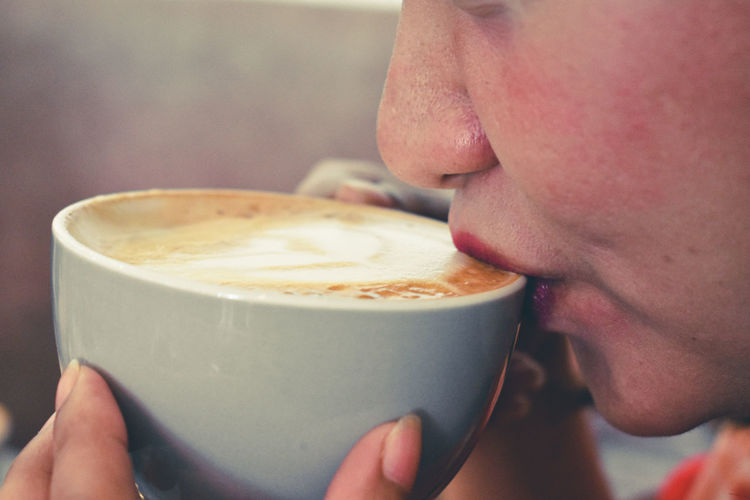 Close-up of man holding coffee