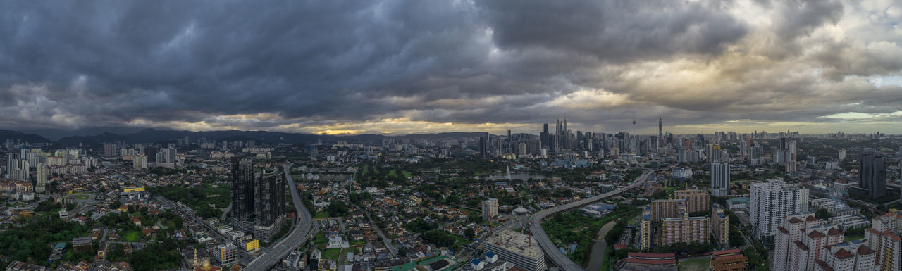 High angle view of city against cloudy sky