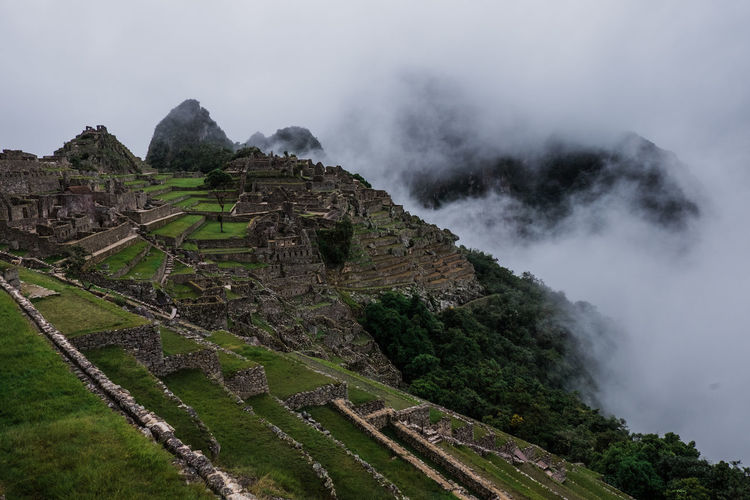 View towards machu picchu on a cloudy and rainy day