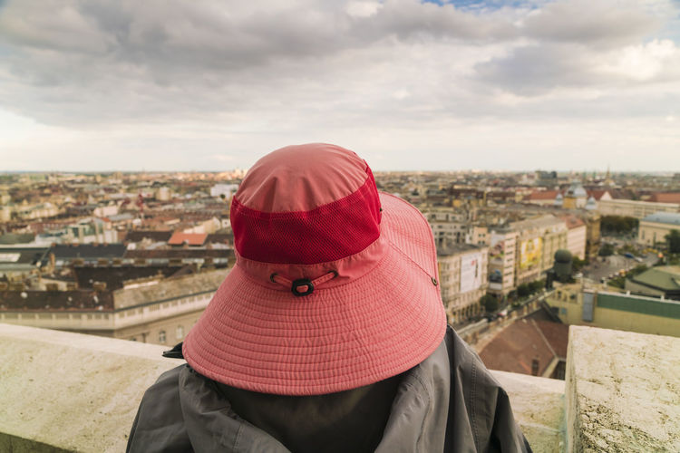 Lady with a hat enjoying view of budapest from st stephen's basilica