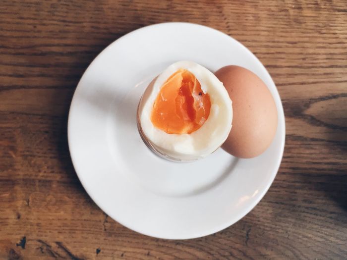 Close-up of boiled egg in plate