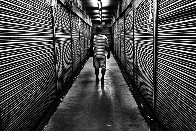 Woman walking in tunnel