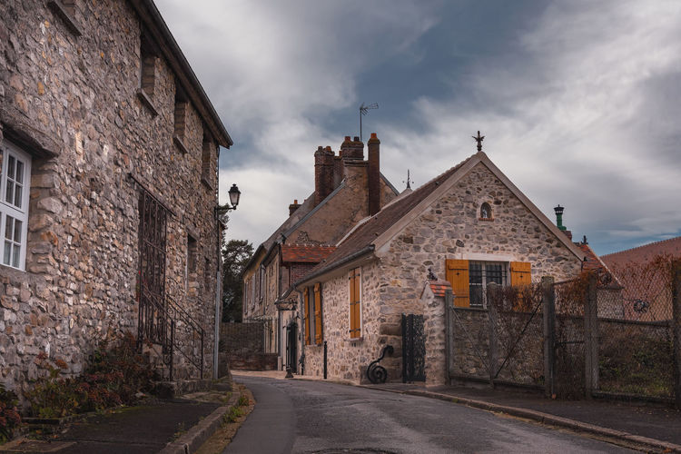 Street amidst buildings against sky