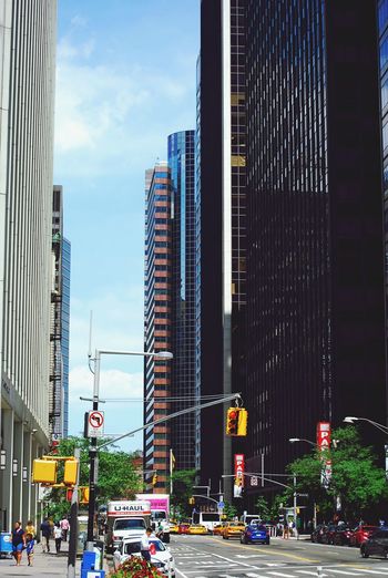 City street and modern buildings against sky