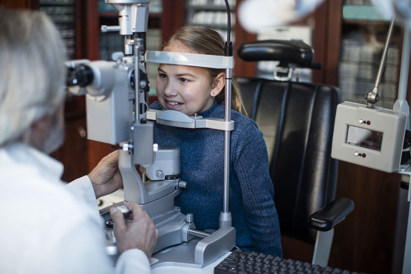 Girl doing eye test at the optometrist