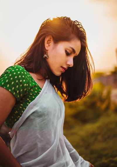 Young woman wearing sari while standing outdoors