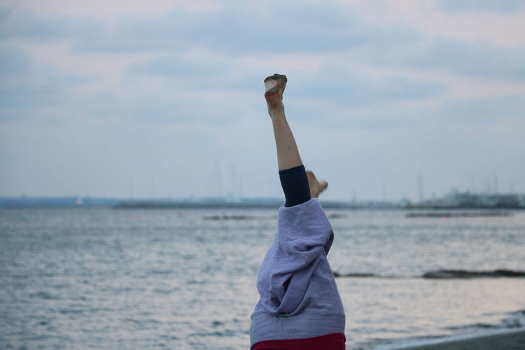 Leisure handstand on beach