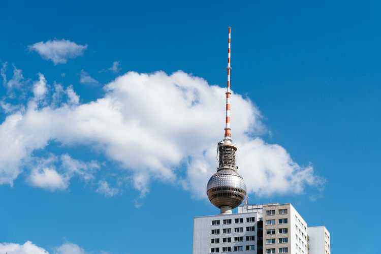Cityscape of berlin with skyscraper and tv tower against blue sky with clouds