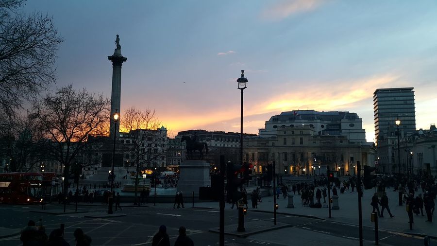 Buildings by trafalgar square against sky during sunset