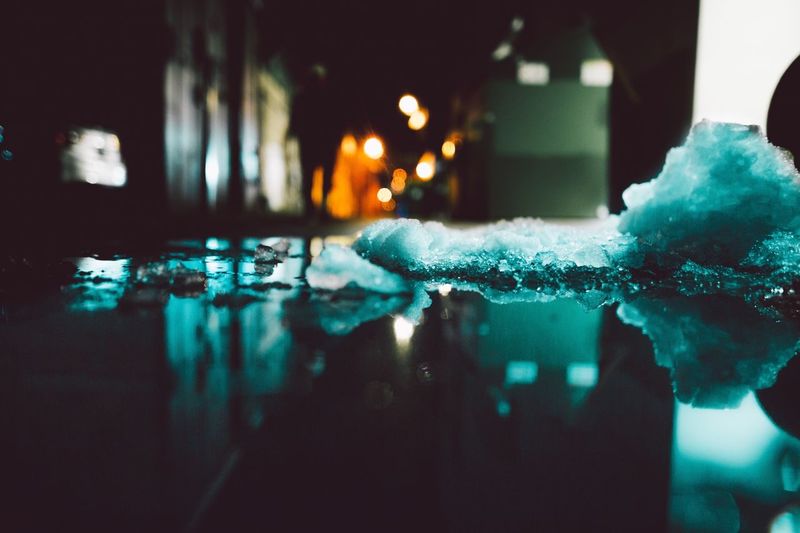 Illuminated fountain at night