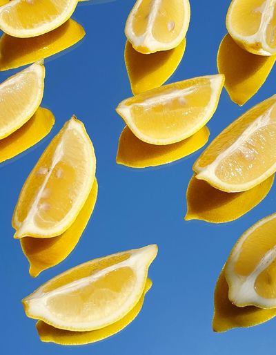 Close-up of fruits against blue background