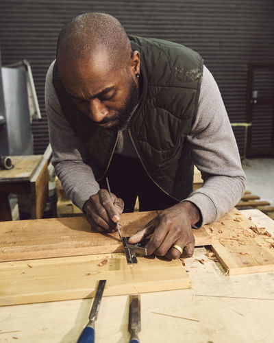 Carpenter working at workshop