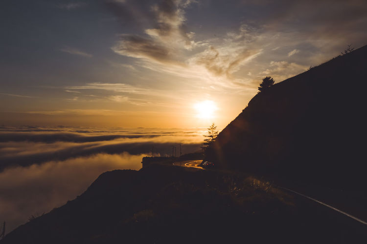 Highway 101 during sunset above clouds creating magical mood
