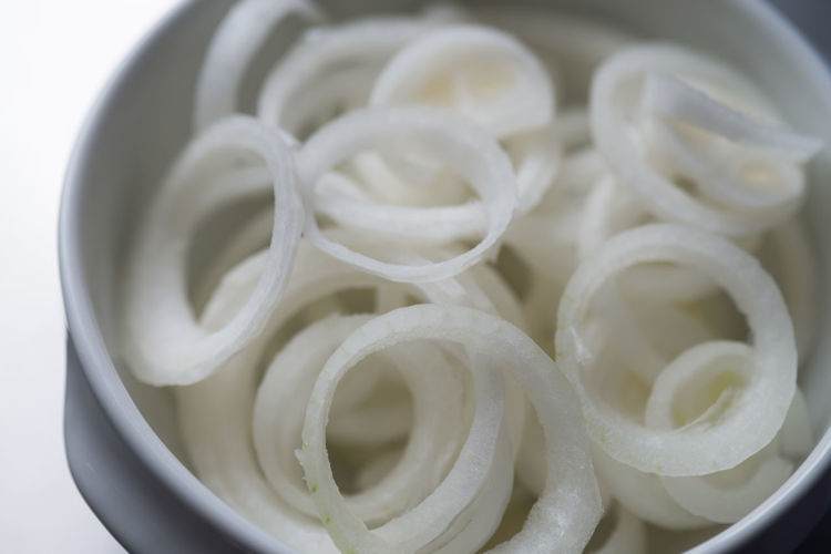 Close-up of sliced onions in container