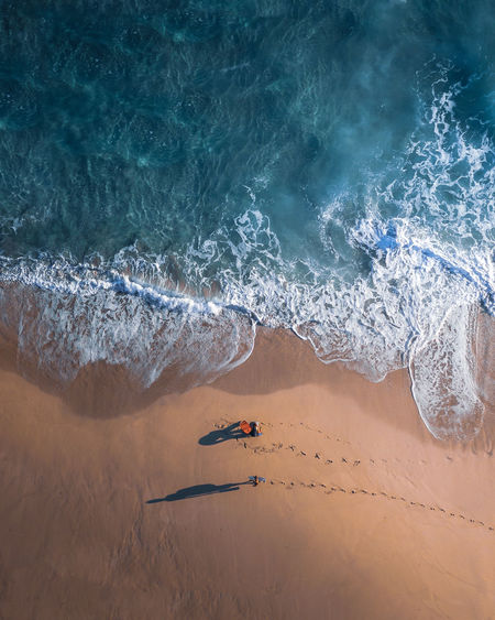 High angle view of people on sea shore