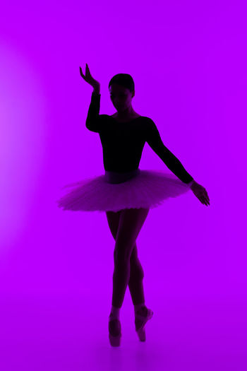 Silhouette ballet dancer dancing in studio