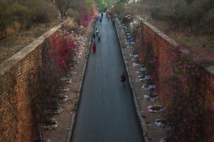 High angle view of people walking on footpath