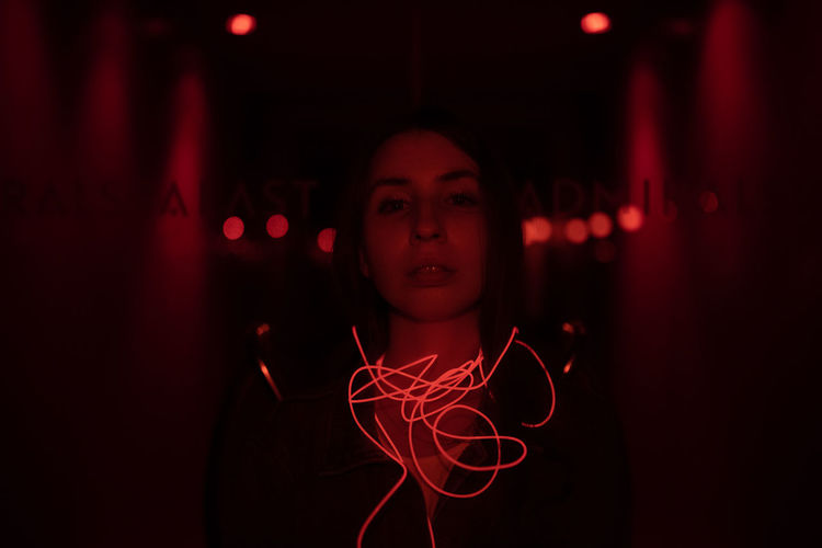 Digital composite image of woman with light painting