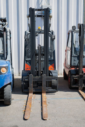 Forklifts parked outside a storage center.