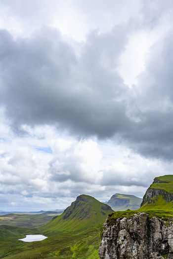 Lake, cliff, sky with clouds in quiraing isle of skye scotland