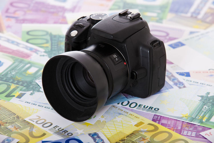 Close-up of camera on paper currency