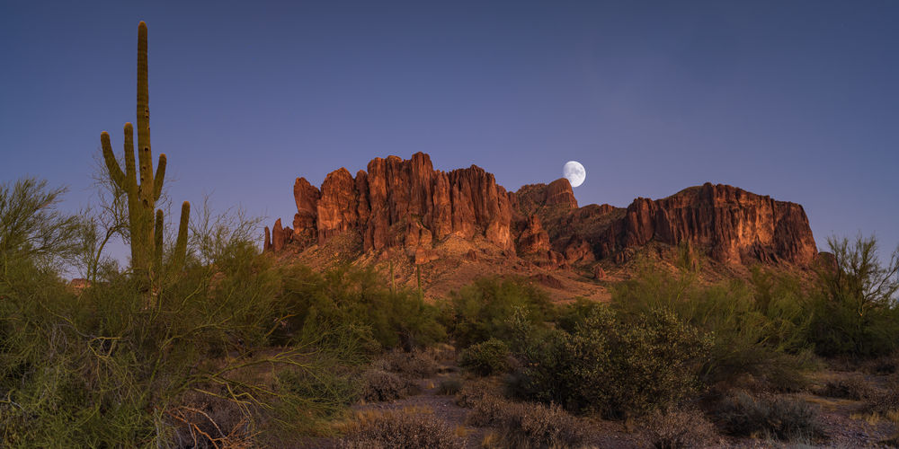Rock formations on landscape against clear sky