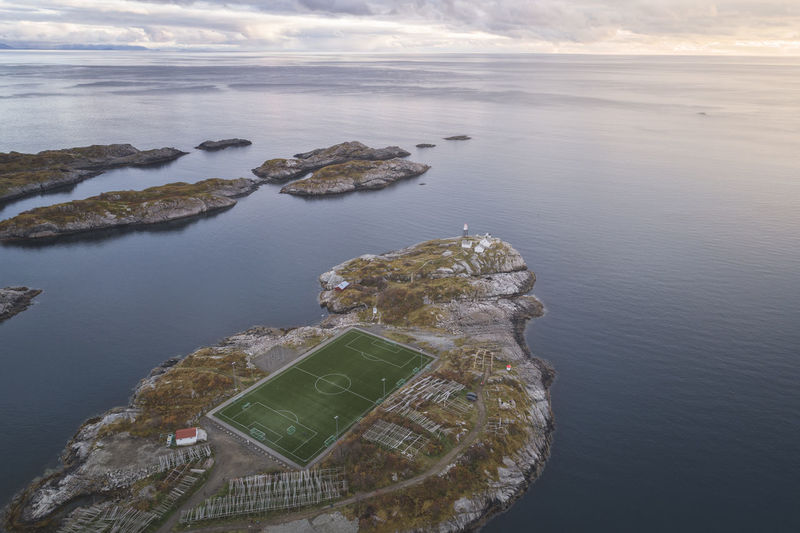 Soccer field on the cliffs of henningsvær by the sea
