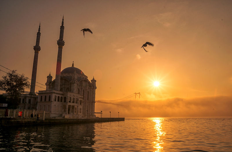 Ortakoy mosque and 15 july martyrs in foggy morning istanbul turkey 