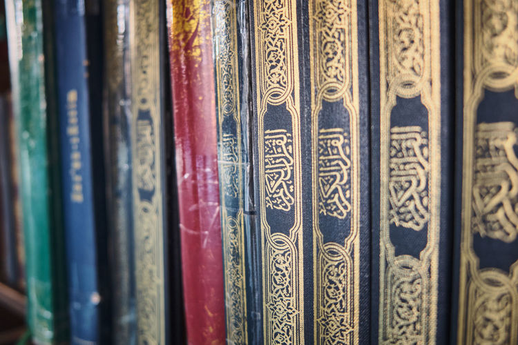 Holy quran on a book shelf. grand mosque, diyarbakir, turkey - june 2021.