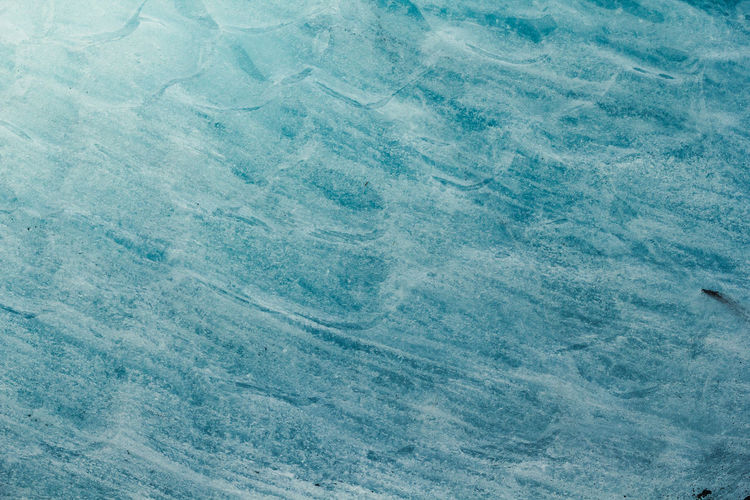 Close up blue wavy ice surface concept photo