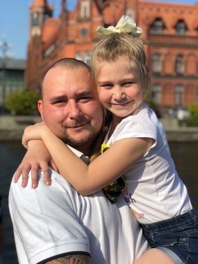 Portrait of smiling father and daughter