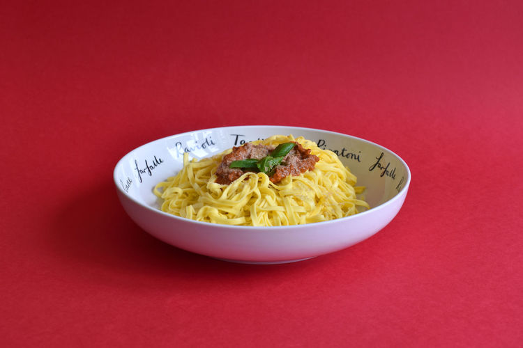 High angle view of spaghetti in a bowl on a table