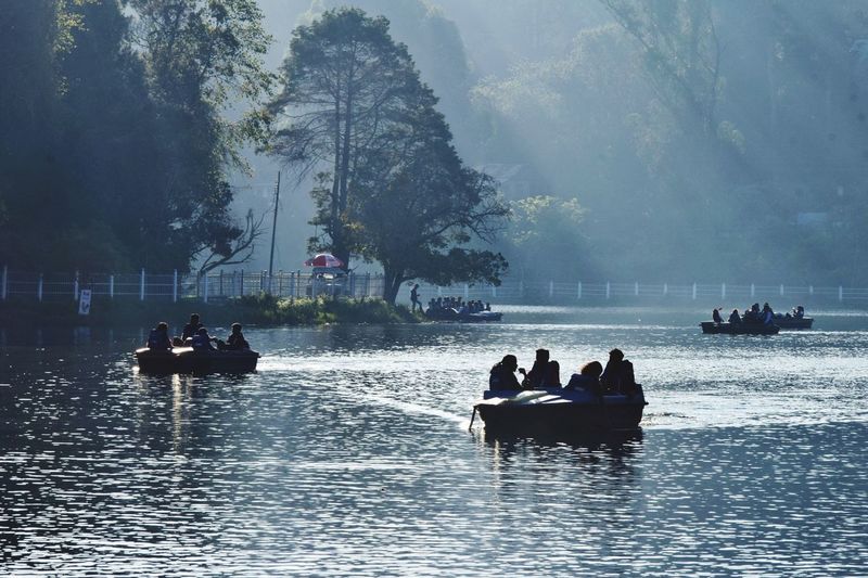 People on boats in water