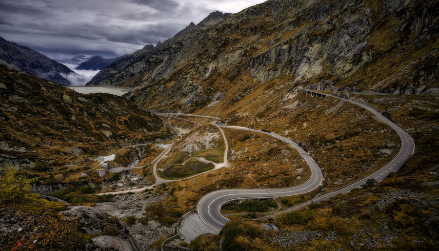 High angle view of road by mountain against sky