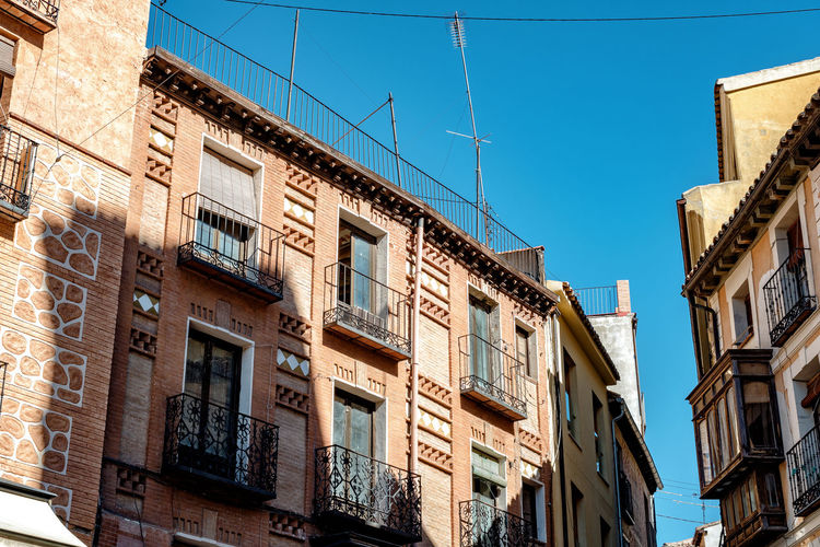 Low angle view of buildings against clear sky