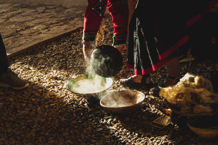 Woman throwing hot water in plates