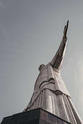 Low angle view of statue of building against clear sky