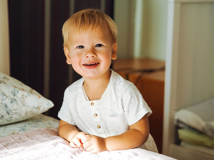 Pretty caucasian 1 year boy smiling and laughing