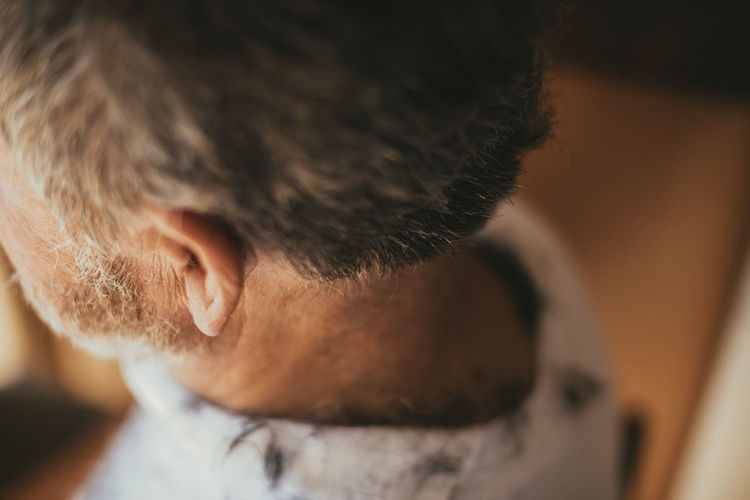 High angle view of man with hair on back at barber shop
